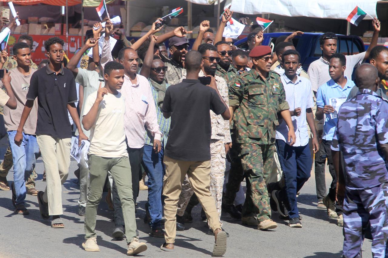 Sudanese take to the street during a rally in support of the Sudanese regular army in their battle against the paramilitary Rapid Support Forces (RSF) in Khartoum, Sudan on Dec. 13, 2025. (AFP Photo)