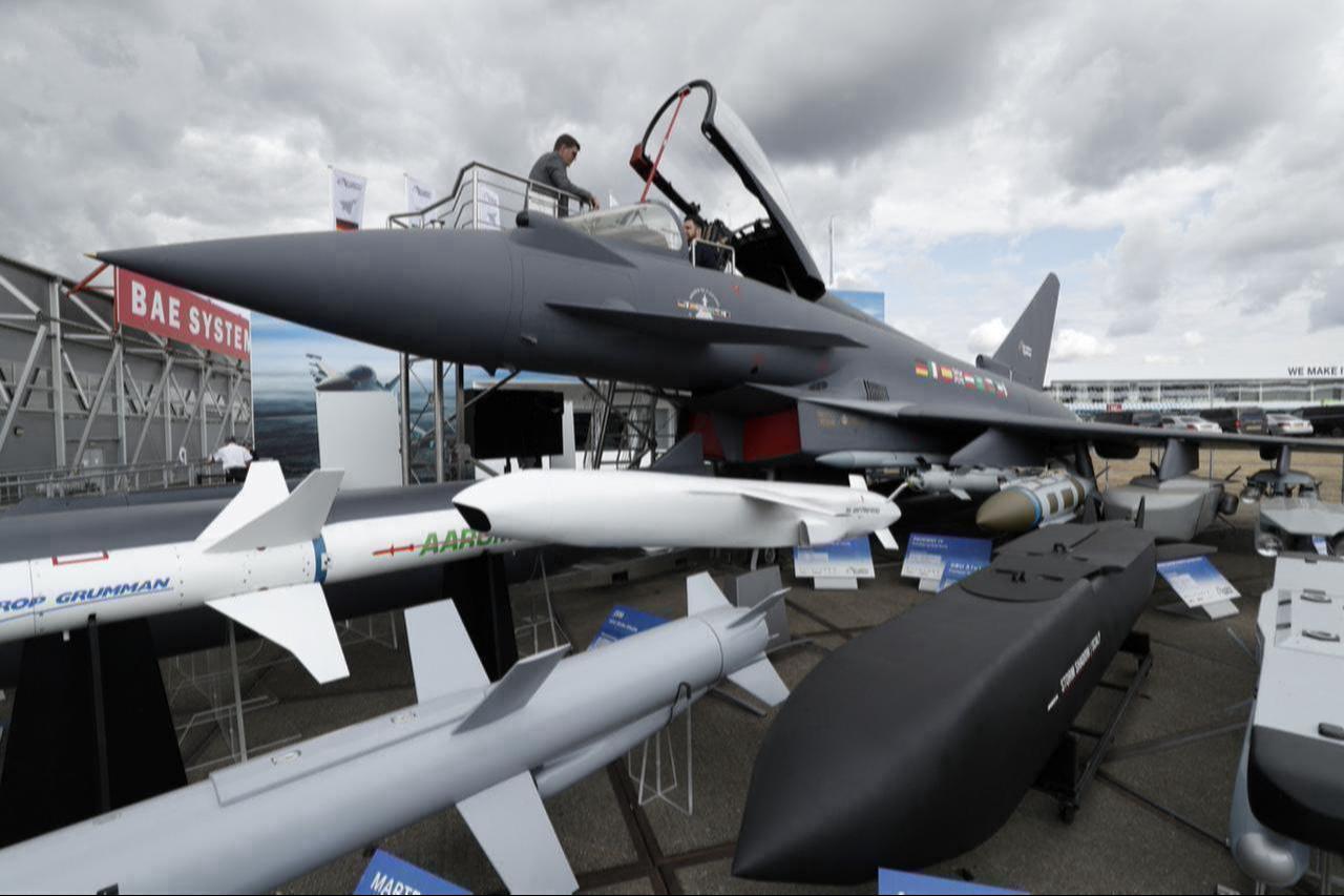 A person sits in the cockpit of a Eurofighter Typhoon aircraft at the BAE Systems exhibition space during Farnborough Airshow, south west of London, July 18, 2018. (AFP Photo)