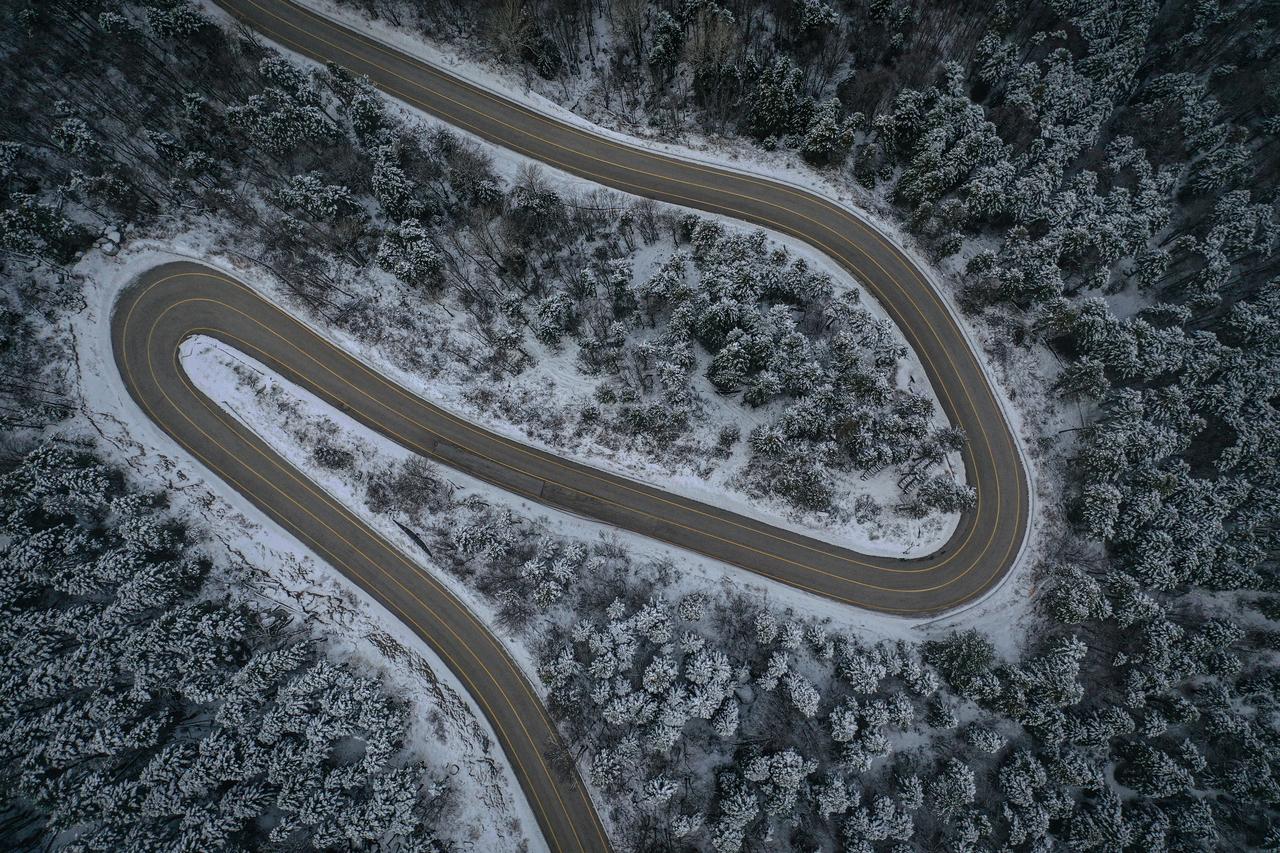 An aerial view of curving roads covered with a white blanket after heavy snowfall on Mount Uludag, Bursa, Türkiye, Dec. 2, 2025. (AA Photo)