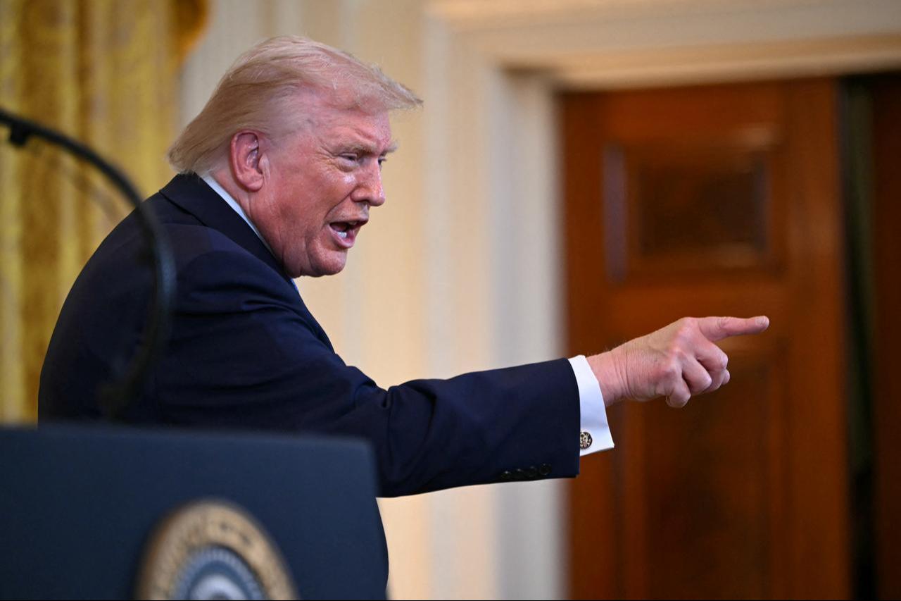 US President Donald Trump points to attendees during a Hanukkah reception in the East Room of the White House in Washington, DC on December 16, 2025. (AFP Photo)