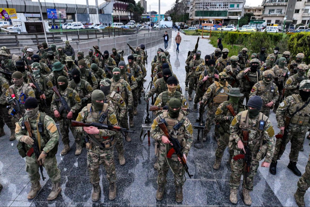 This aerial picture shows fighters affiliated with Syria's new administration gathering at Abbasid Square for a military parade in Damascus, Syria on Dec. 27, 2024. (AFP Photo)
