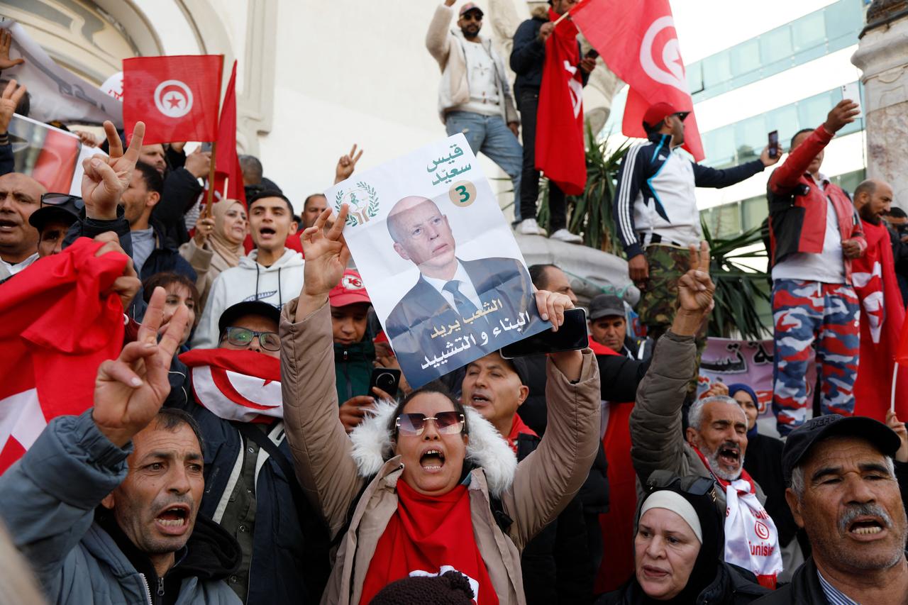Supporters of Tunisian President Kais Saied shout slogans during a demonstration on the 15th anniversary of the start of the 2011 revolution in Tunis on December 17, 2025. (AFP Photo)