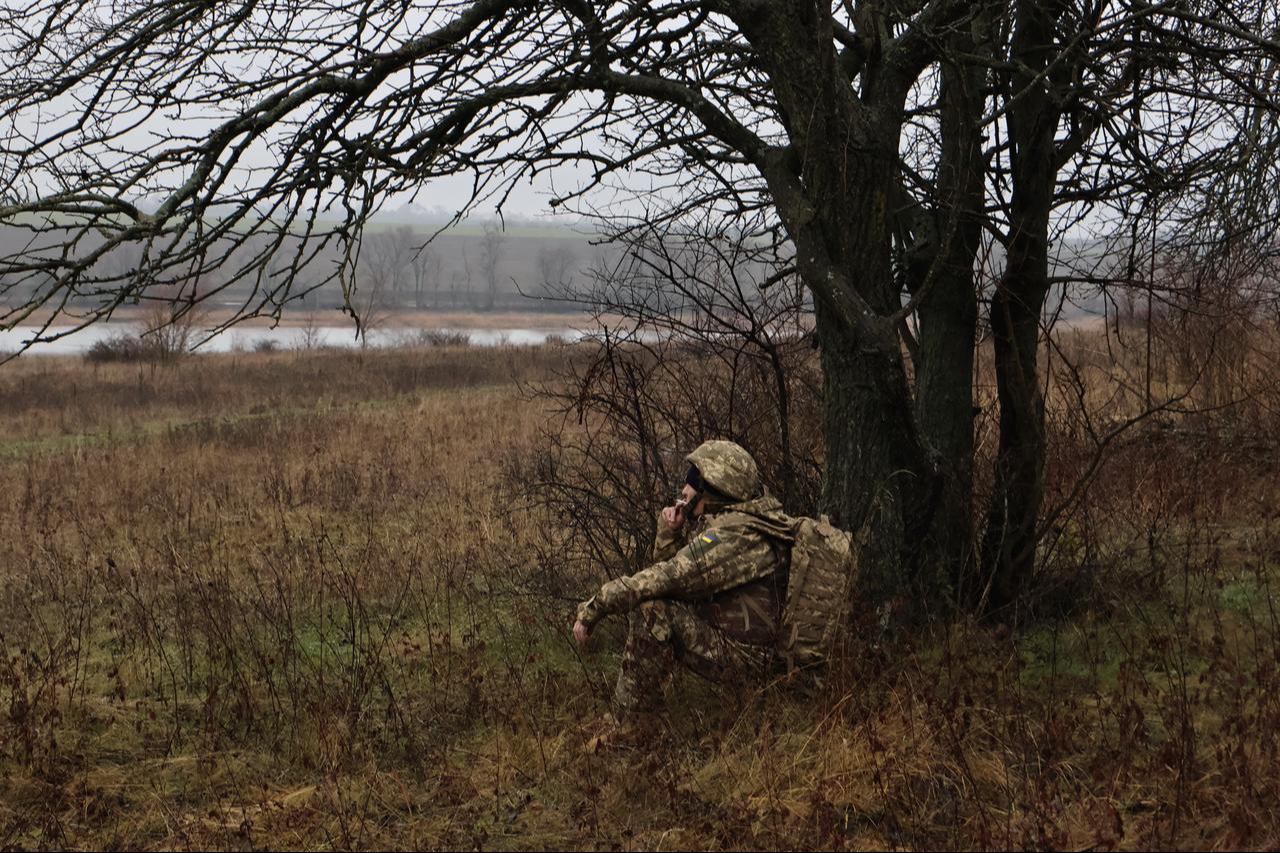 A Ukrainian recruit smokes as he rests during basic military training at an undisclosed location in Zaporizhzhia, Dec. 12, 2025. (Photo by Andriy Andriyenko/65th Mechanized Brigade of Ukrainian Armed Forces/AFP)