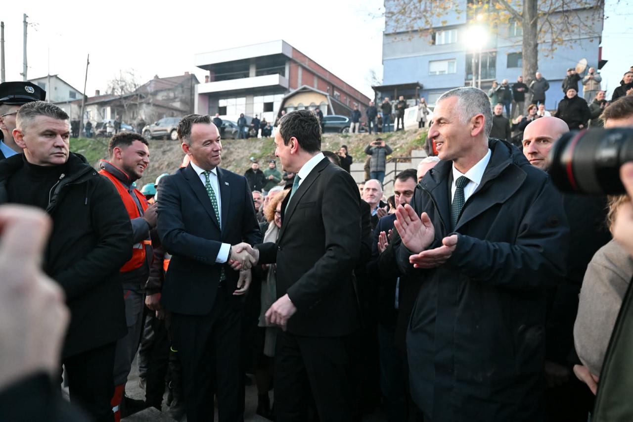 Photo shows caretaker Prime Minister Albin Kurti (R) shaking hands with Mitrovica Mayor Faton Peci (L) during  the inauguration of a new pedestrian bridge over the Iber River, Mitrovica in Municipality, Kosovo on Dec. 18, 2025. (Photo via Mitrovica Municipality official website)