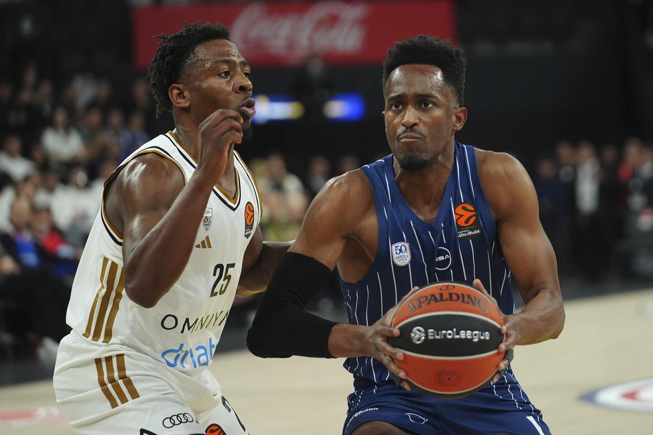 Anadolu Efes’ Rodrigue Beaubois and Dubai’s McKinley Wright IV (25) compete for the ball during a EuroLeague week 17 match between Anadolu Efes and Dubai at Turkcell Basketball Development Center in Istanbul, Türkiye, on Dec. 19, 2025. (AA Photo)
