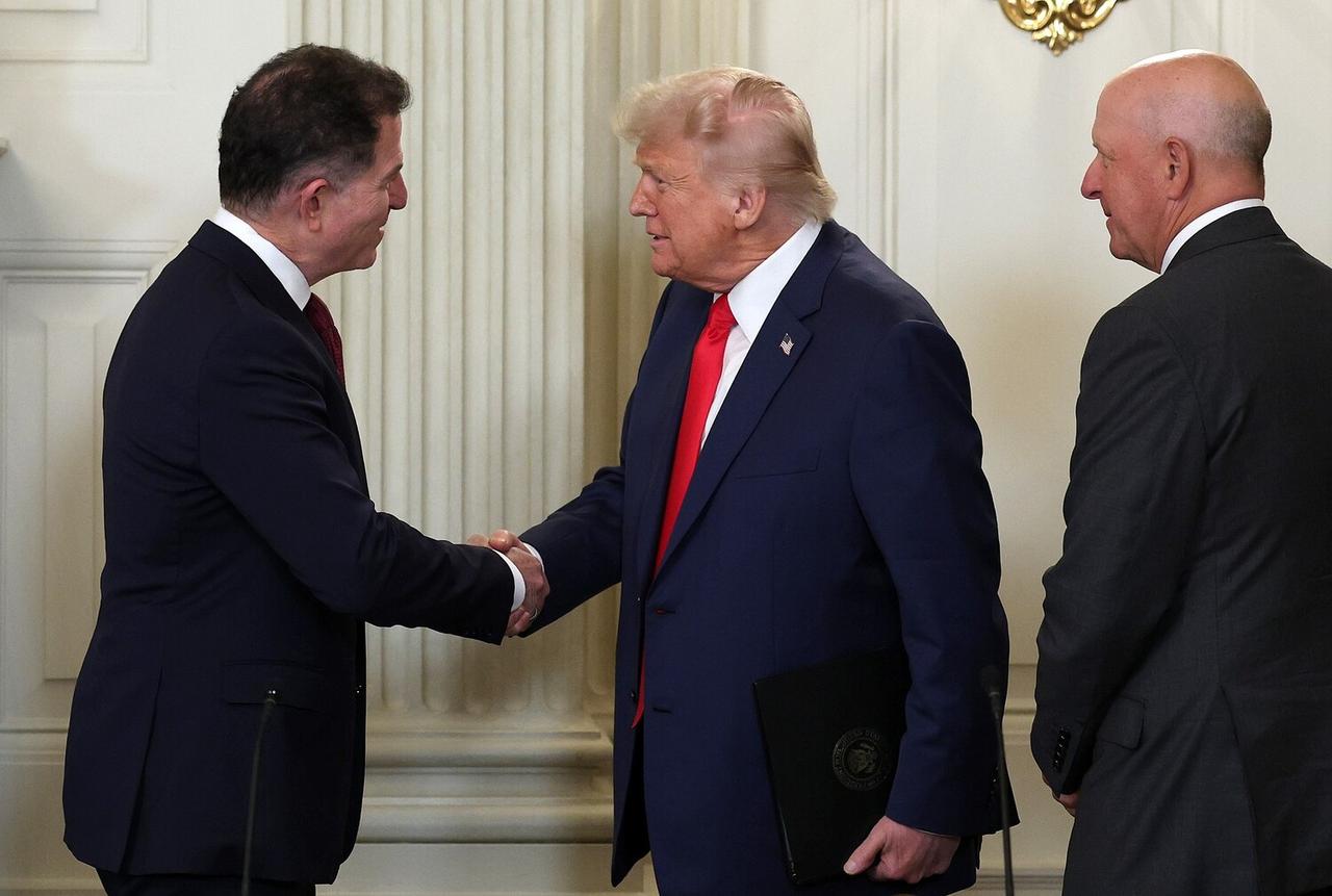 US President Donald Trump greets Dell Technologies CEO Michael Dell (L) as they arrive for the Invest America Roundtable in the State Dinning room at the White House in Washington, DC on June 09, 2025. (AFP Photo)