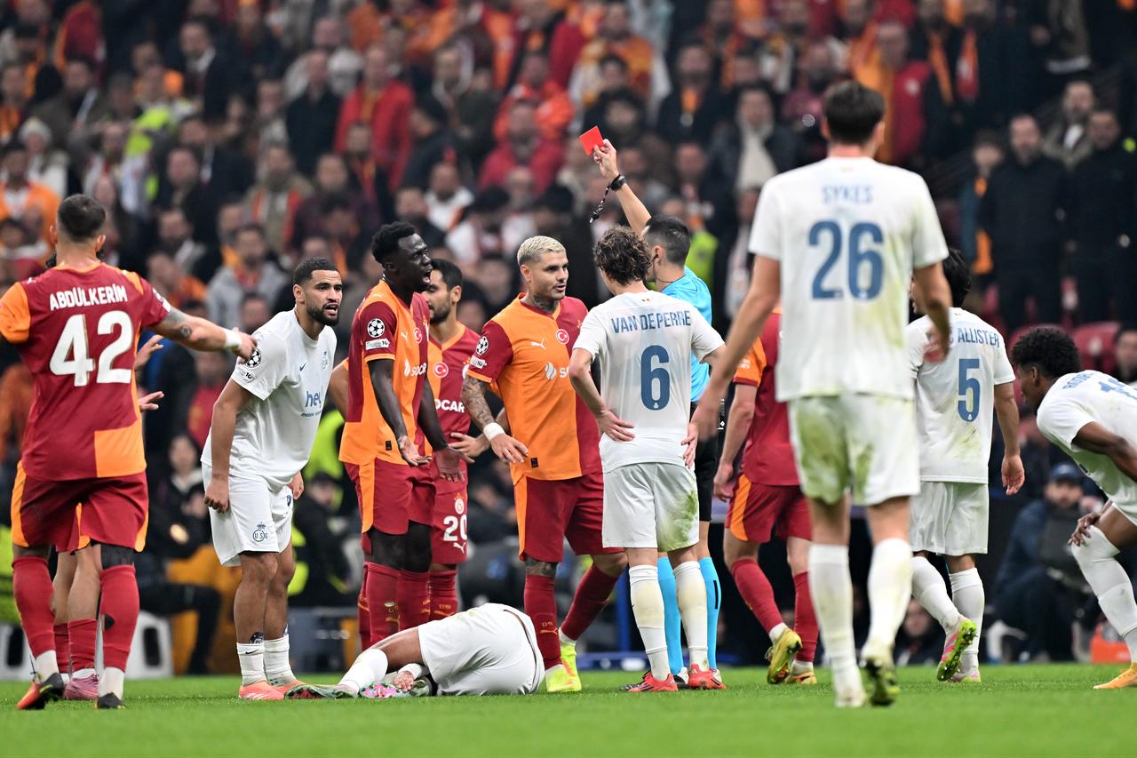 Spanish referee Jose Maria Sanchez Martinez shows a red card to Galatasaray defender Arda Unyay during the Champions League group-stage match against Union Saint-Gilloise in Istanbul, Türkiye. (AA Photo)