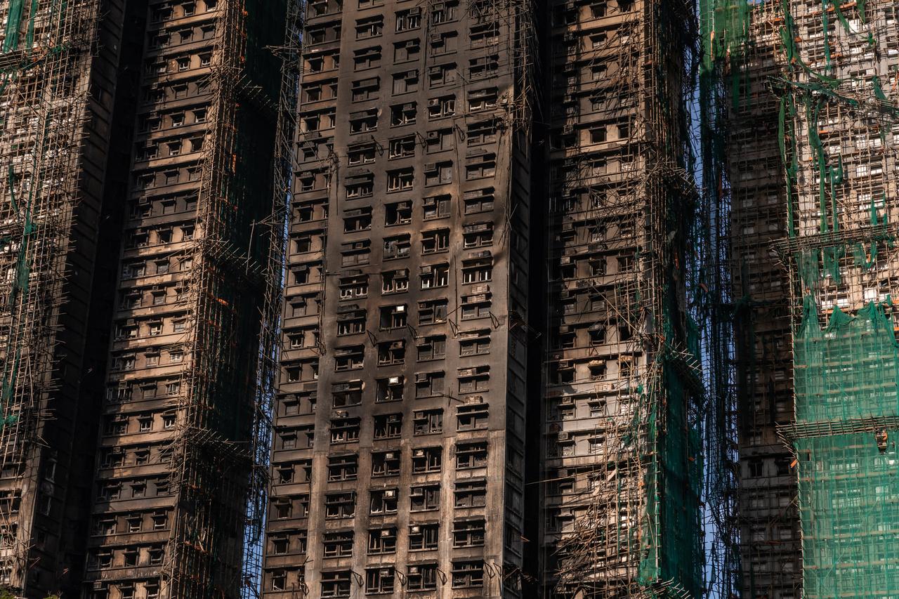 A wide view captures the scene after a massive fire tore through multiple apartment buildings at the Wang Fuk Court residential estate in Hong Kong’s Tai Po district. November 28, 2025. (AFP PHOTO)