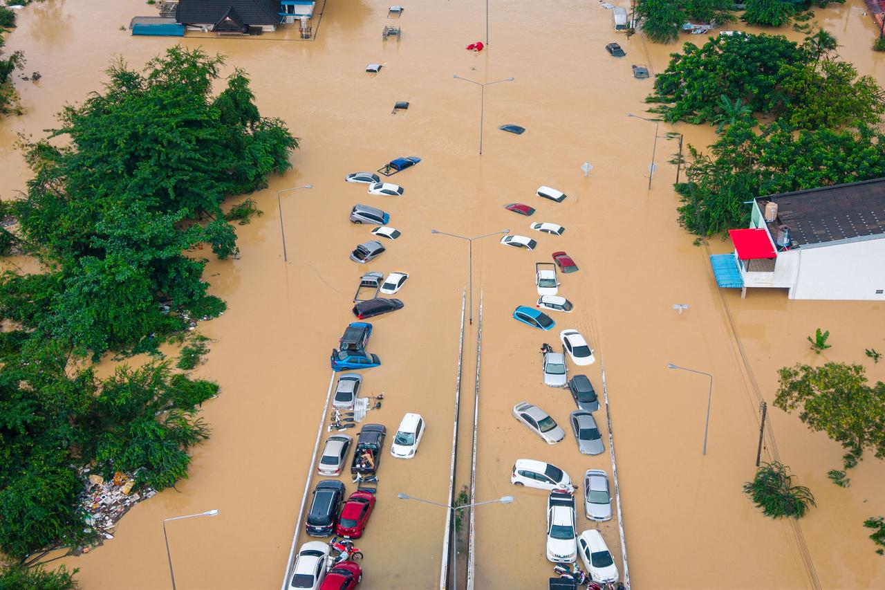 This aerial image shows floodwaters covering vehicles in Hat Yai, Songkhla province, Thailand, November 26, 2025. (AFP Photo)