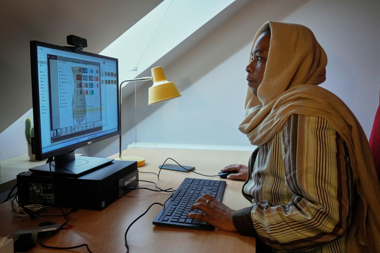 Archaeologist from Sudan's National Museum Shadia Abdrabo, poses at her office at the French National Institute for Art History (INHA) in Paris, France, Oct. 29, 2025. (Photo via phys.org)