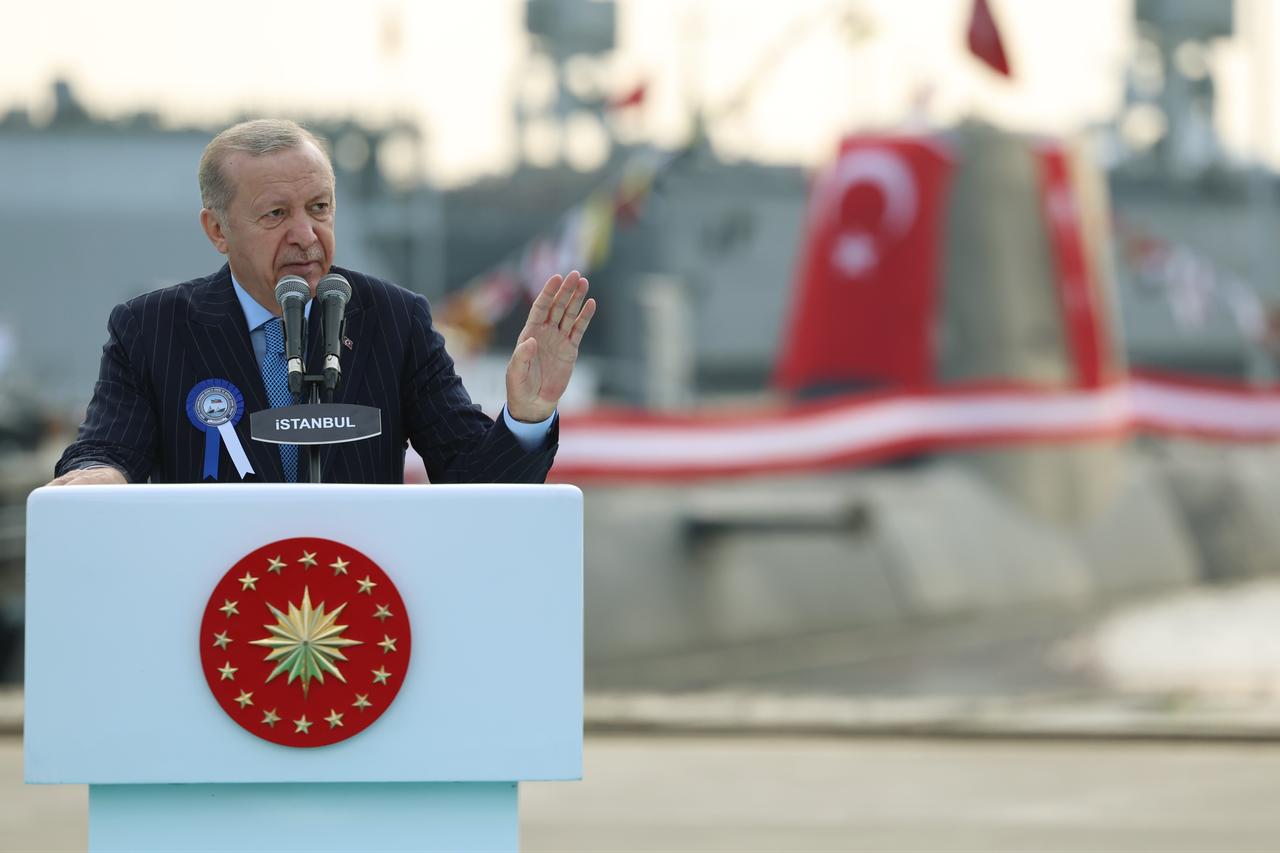 President Erdogan speaking, with TCG Hizirreis submarine can be seen in the background, at a ceremony held at the Istanbul Shipyard Command in Istanbul, Dec. 20, 2025. (Photo via Turkish Presidency/Murat Cetinmuhurdar)