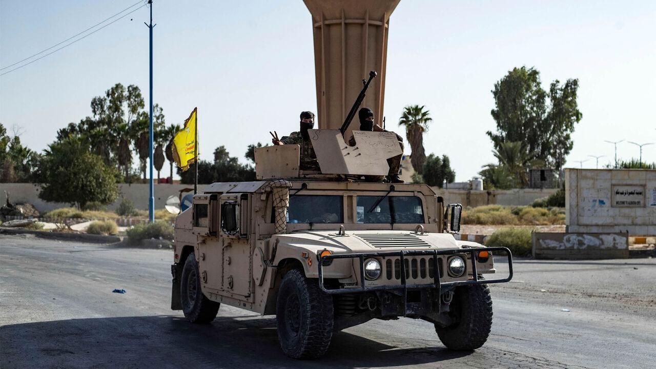 A vehicle of SDF is pictured along a road as terrorists deploy to impose a curfew in al-Busayrah, northeastern Deir ez-Zor province, Syria, Sept. 4, 2023. (AFP Photo)
