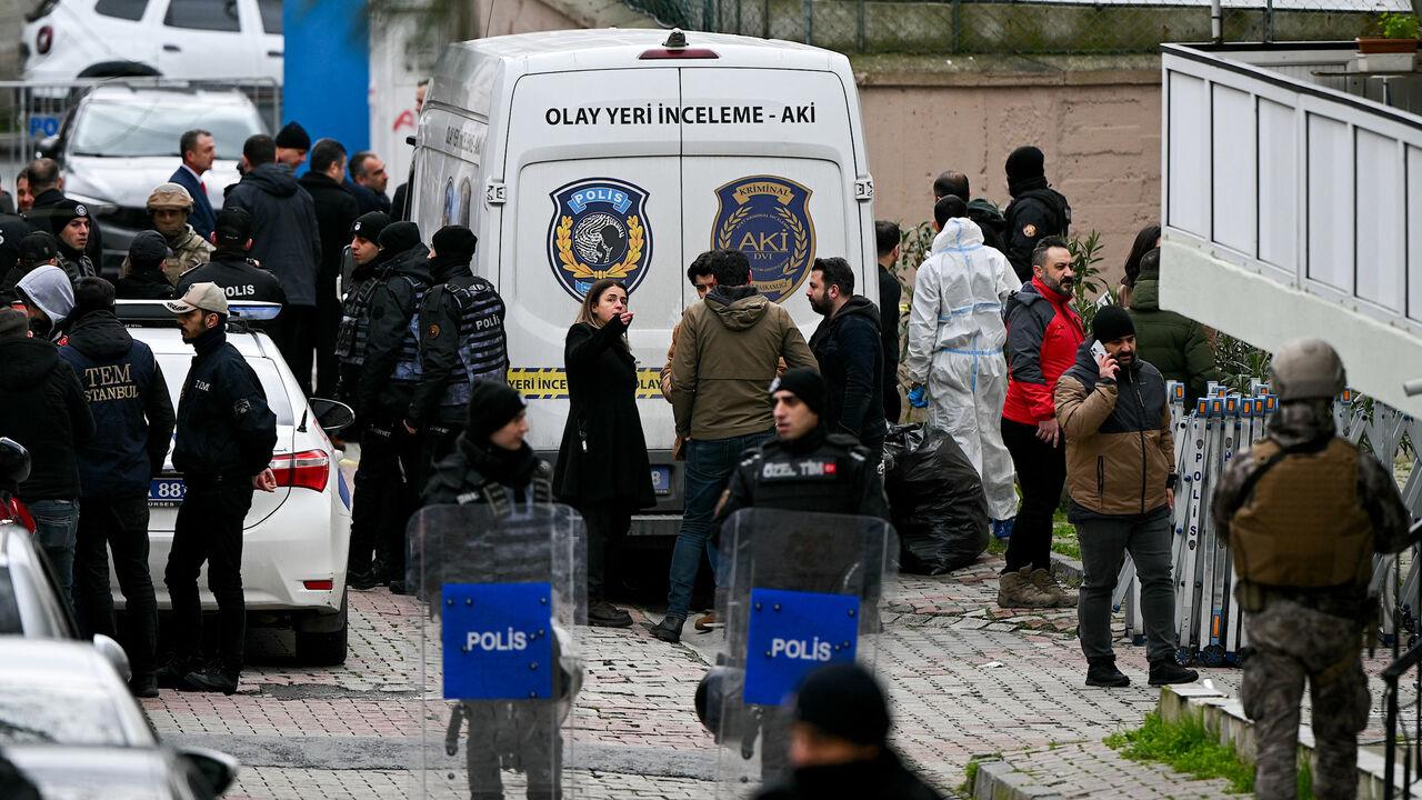 Turkish forensic police stand in front of Santa Maria church after an attack, in Istanbul, on January 28, 2024. (AFP Photo)