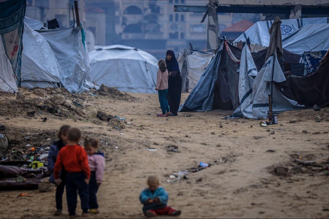 Palestinians displaced by Israeli attacks struggle to survive in makeshift tents set up along Al-Rashid Street in western Gaza City, Gaza on Dec. 15, 2025. (AA Photo)