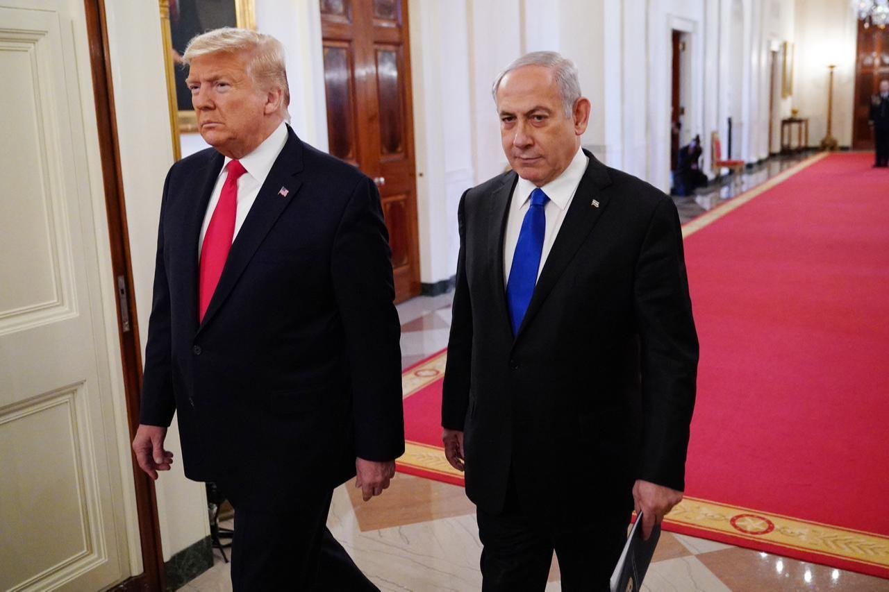 US President Donald Trump and Israeli Prime Minister Benjamin Netanyahu arrive for an announcement of Trumps Middle East peace plan in the East Room of the White House in Washington, DC on Jan. 28, 2020. (AFP Photo)