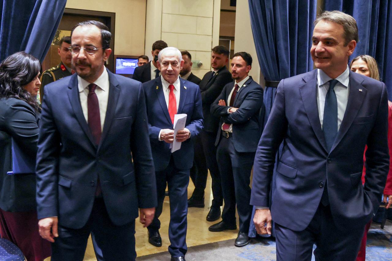 Cyprus' President Nikos Christodoulides (L) Israel's Prime Minister Benjamin Netanyahu (C) and Greek Prime Minister Kyriakos Mitsotakis (L) walking ahead of a trilateral summit in Jerusalem, Israel on Dec. 22, 2025. (Cyprus's Press and Information Office/AFP Photo)