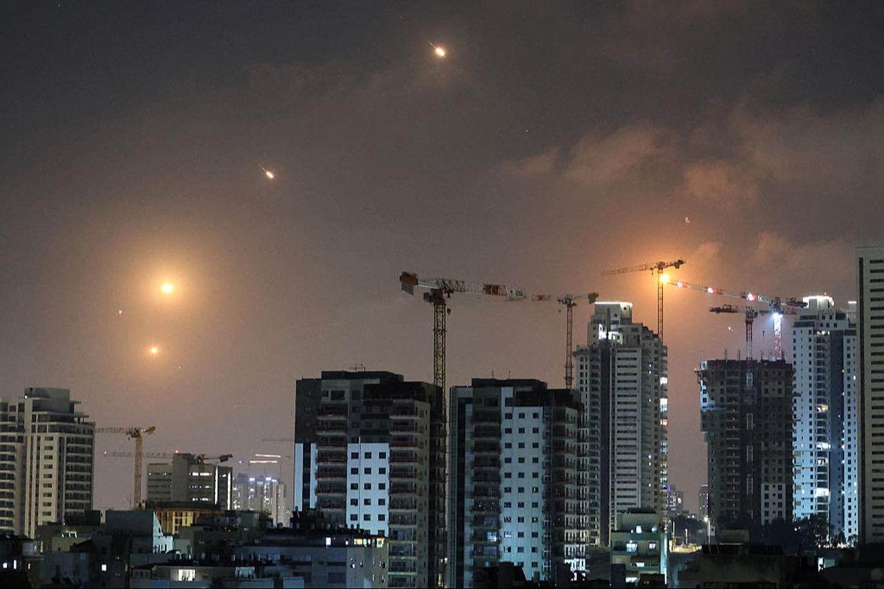 This picture shows rocket trails in the sky above Netanya on June 13, 2025. (AFP Photo)