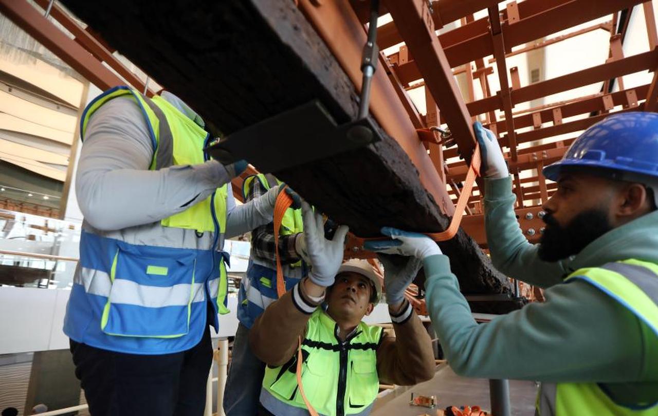 The restoration team work on the restoration project for the ancient King Khufu's second solar boat at the Grand Egyptian Museum in Cairo, Egypt, Dec. 23, 2025. (Photo via Xinhua/Ahmed Gomaa)