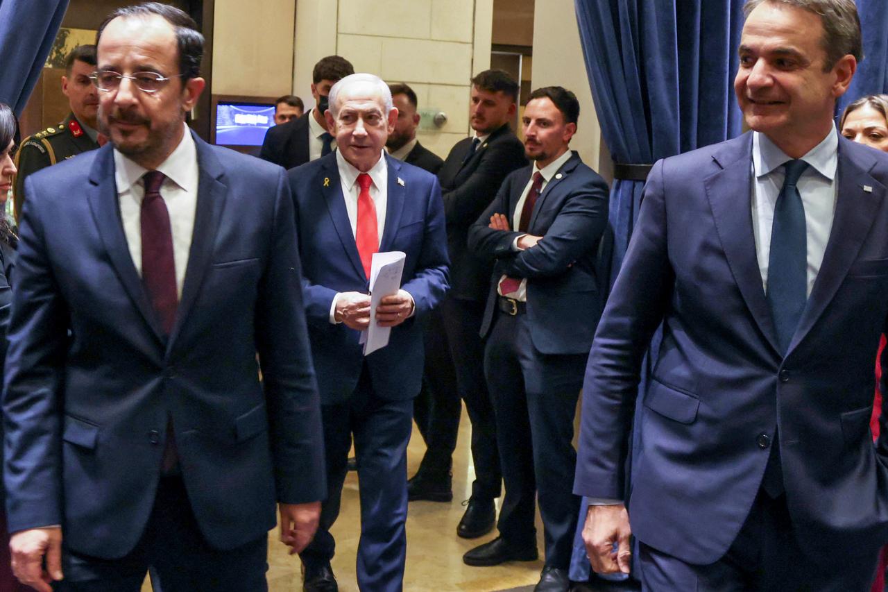 This handout picture shows Greek Cypriot leader Nikos Christodoulides, Israel's Prime Minister Benjamin Netanyahu, and Greek Prime Minister Kyriakos Mitsotakis walking ahead of a trilateral summit in Jerusalem on December 22, 2025. (AFP Photo)
