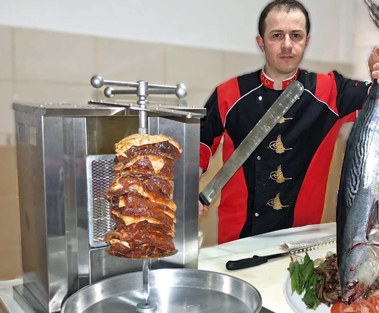 A Turkish chef prepares fish doner by mounting layered slices on a vertical rotisserie, demonstrating how the classic doner technique is adapted to seafood while preserving its traditional cooking method. (Photo via YouTube/@ChefSalimRecipes)