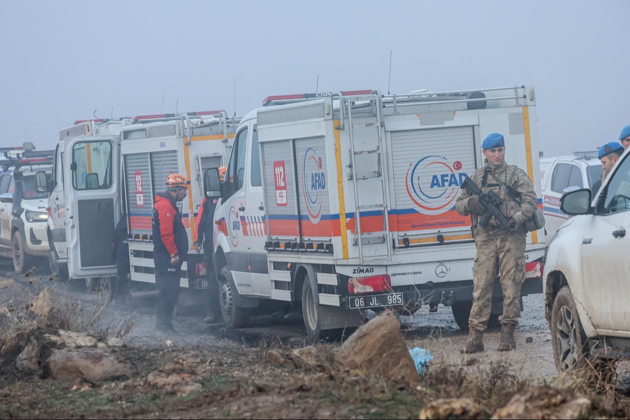 A Turkish soldier patrols as search and rescue operations continue at the wreckage site following the crash of a Libya-bound business jet in Ankara, on Dec. 24, 2025. (AFP Photo)