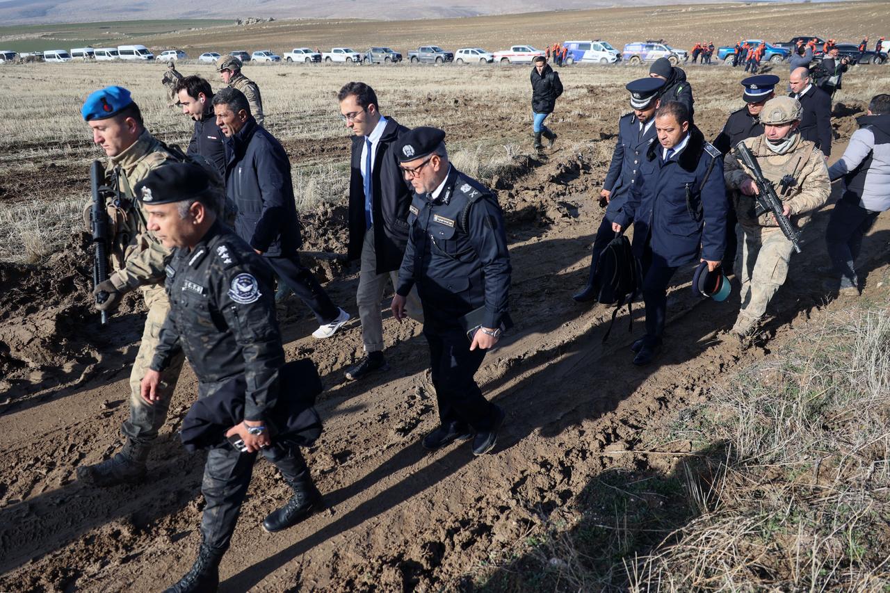Libyan military delegation members arrive at the wreckage site following the crash of a Libya-bound business jet carrying Libyan Chief of Staff General Muhammad Ali Ahmed Al-Haddad, found 2 kilometers south of Kesikkavak Village at Haymana district in Ankara on Dec. 24, 2025. (AFP Photo)