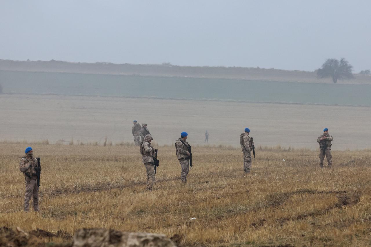Turkish soldiers patrol as search and rescue operations continue at the wreckage site following the crash of a Libya-bound business jet carrying Libyan Chief of Staff General Muhammad Ali Ahmed Al-Haddad, found 2 kilometers south of Kesikkavak Village at Haymana district in Ankara on Dec. 24, 2025. (AFP Photo)