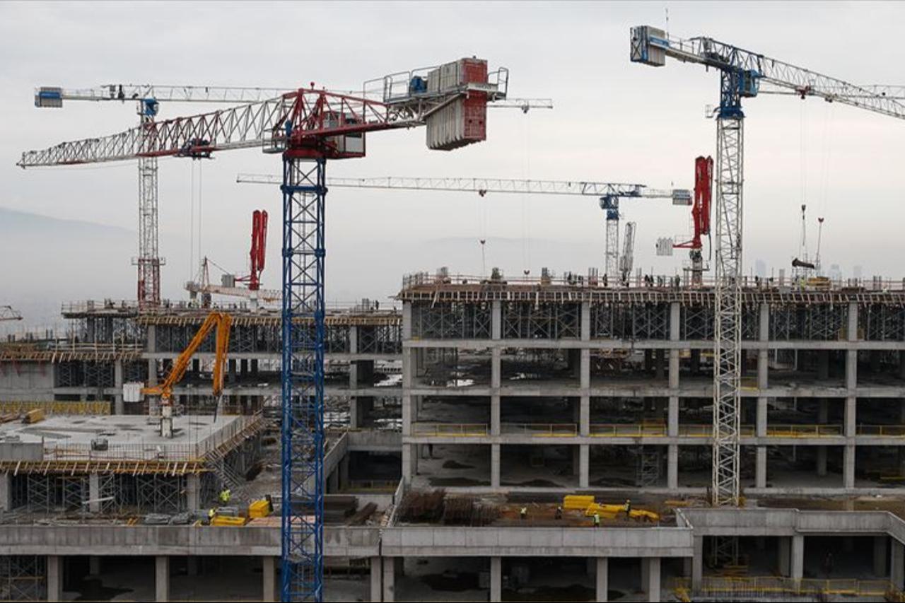 Construction cranes operate at a large-scale building site in Türkiye. (AA Photo)