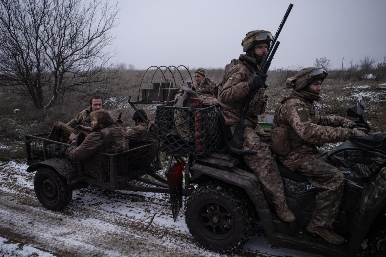 Ukrainian soldiers ride in a trailer as they return from frontline positions near Kostyantynivka at an undisclosed location in Ukraine. (Photo by Iryna Rybakova/The 93rd Kholodnyi Yar Separate Mechanized Brigade/AFP)
