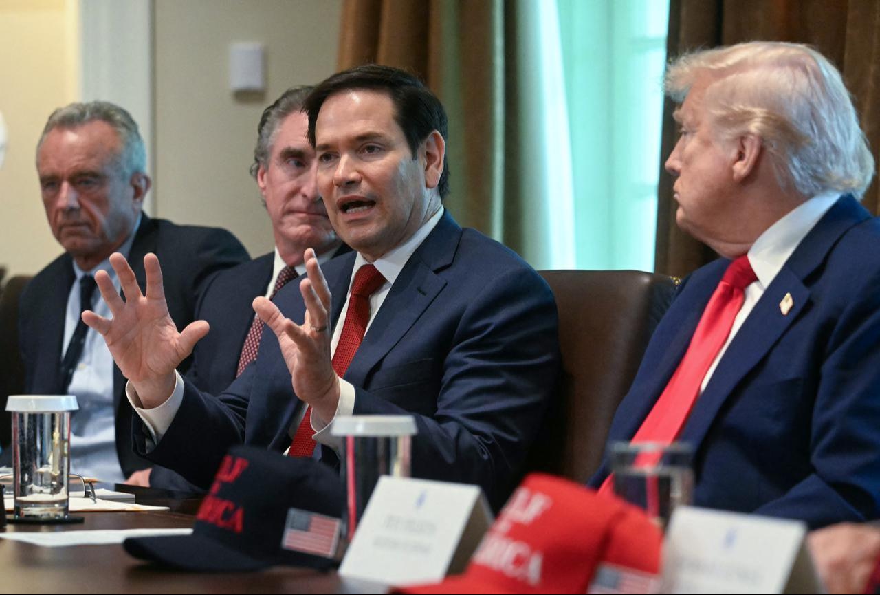 US Secretary of State Marco Rubio speaks  as US President Donanld Trump (R) looks on during a cabinet meeting in the Cabinet Room of the White House in Washington, DC, on April 30, 2025. (AFP Photo)