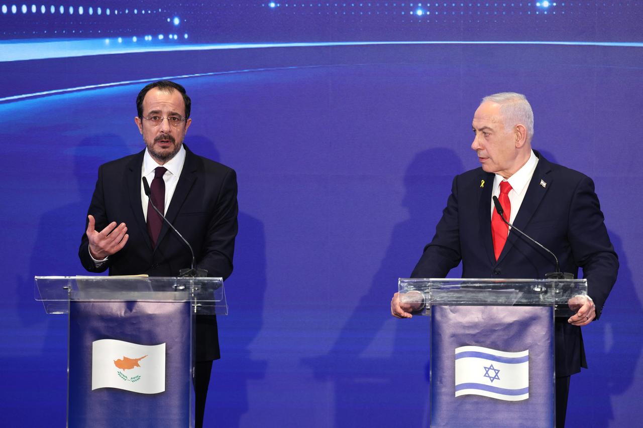 Greek Cypriot leader Nikos Christodoulides (L) speaks as Israeli Prime Minister Benjamin Netanyahu (R) looks on during a joint press conference together with Greece's Prime Minister Kyriakos Mitsotakis (not pictured) after a trilateral meeting in Jerusalem, Israel on Dec. 22, 2025. (AFP Photo)