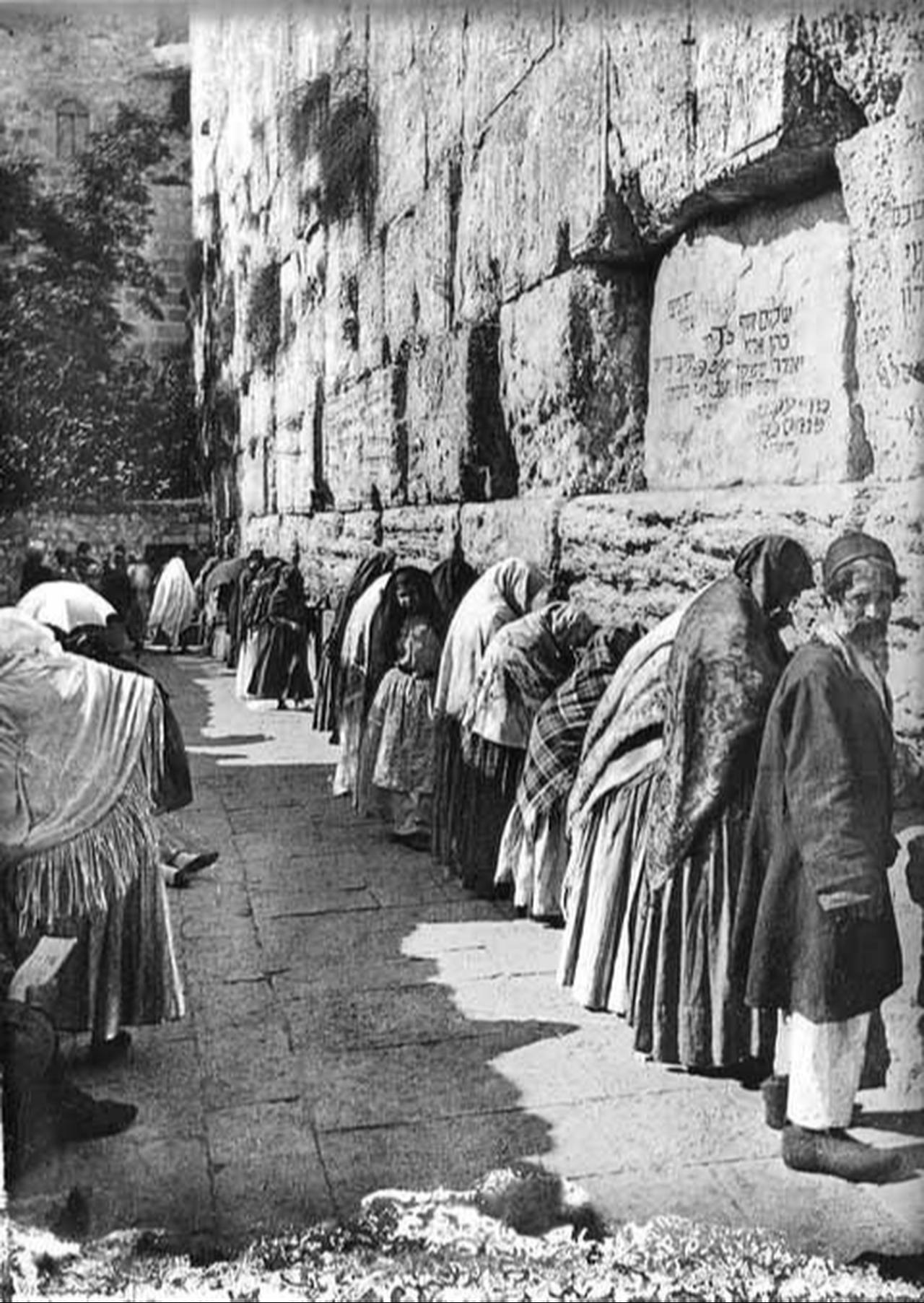 Women made up a disproportionate number of the Jewish population in Palestine at the end of the Ottoman era─this picture of men and women praying at the Kotel in Jerusalem was taken at about this time. (Photo via American Colony Photo Dept.)
