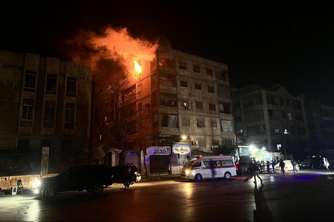 Flames rise from a building hit in an attack carried out by the terrorist organization PKK/YPG in Aleppo, Syria on Dec. 22, 2025. (AA Photo)
