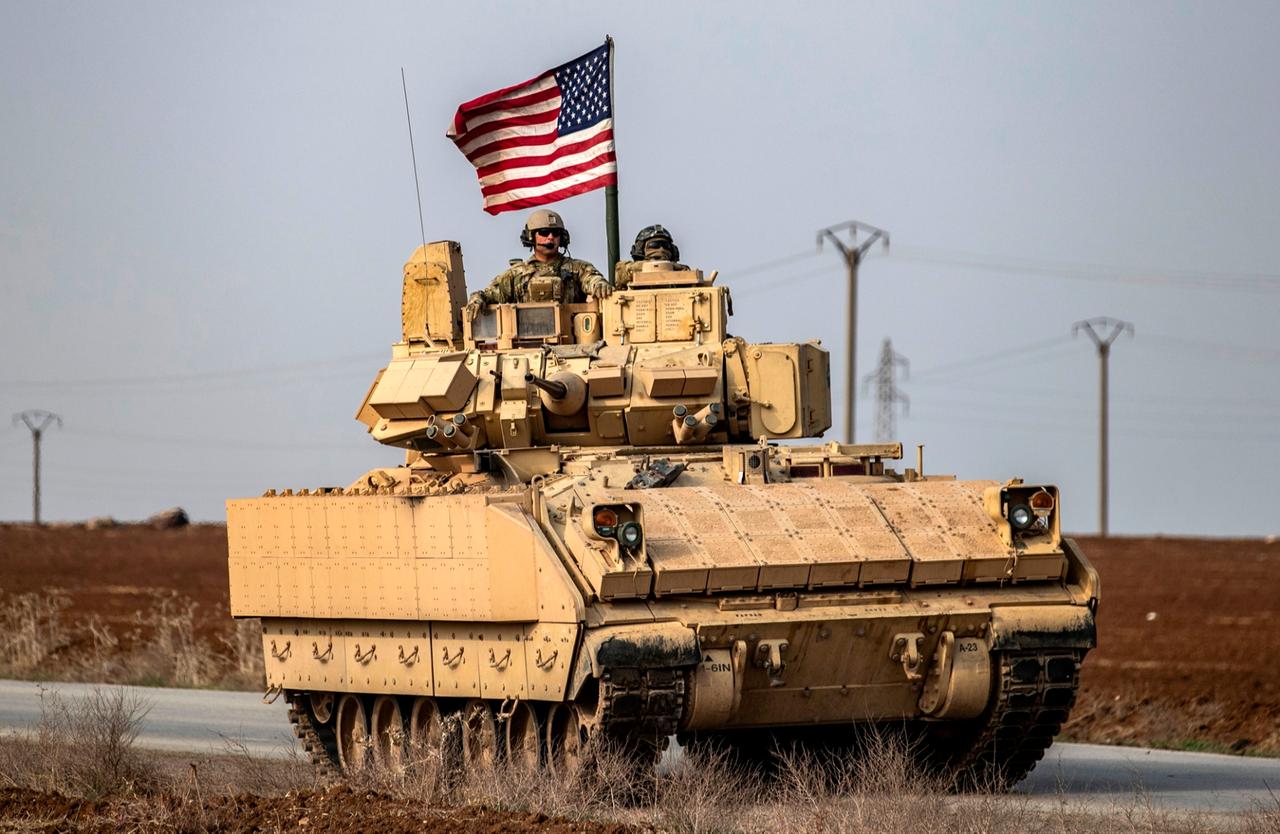 U.S. troops patrol on the roads of the Syrian town of al-Jawadiyah, in the northeastern al-Hasakah, near the border with Türkiye, on December 17, 2020. (AFP Photo)
