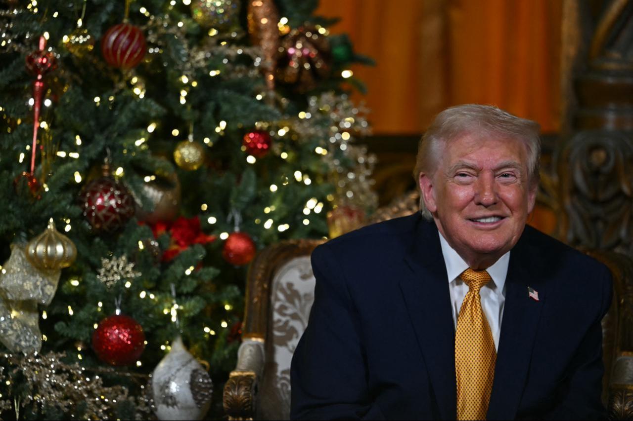 US President Donald Trump participates in NORAD Santa tracker phone calls, on Christmas Eve, from the Mar-a-lago club in Palm Beach, Florida, on Dec. 24, 2025. (AFP Photo)