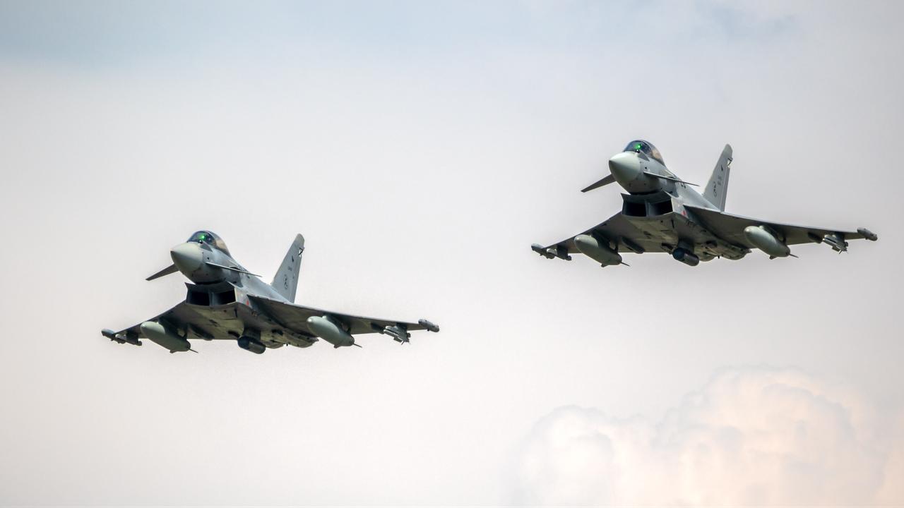 Spanish Air Force Eurofighter Typhoon fighter jets fly by at Florennes Air Base, Belgium, on June 15, 2017. (Adobe Stock Photo)