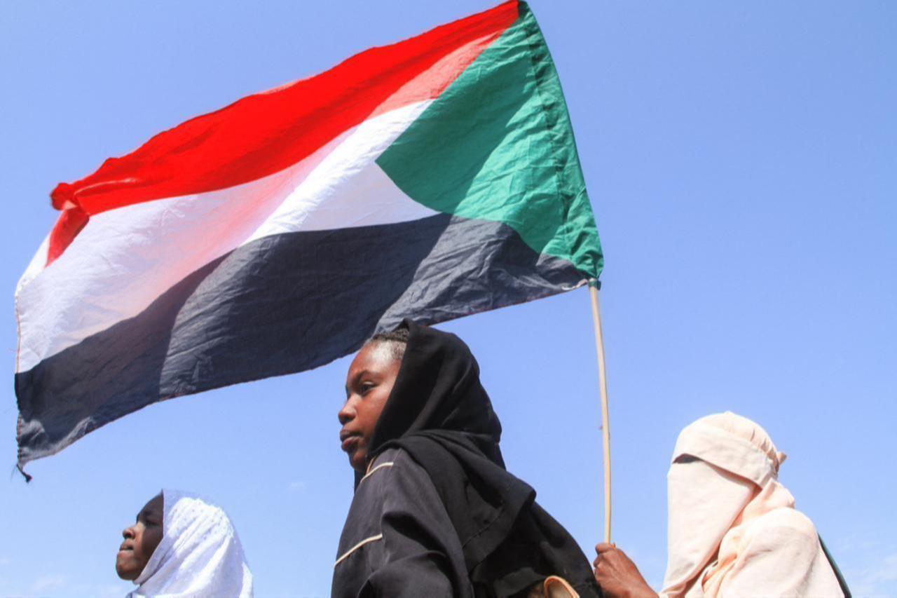 Sudanese Students from schools in the East Nile region of the capital, hold up the Sudan flag, during a protest against violations committed by the Rapid Support Forces (RSF) against the people of El- Fasher, in Khartoum, Sudan on Nov. 3, 2025. (AFP Photo)