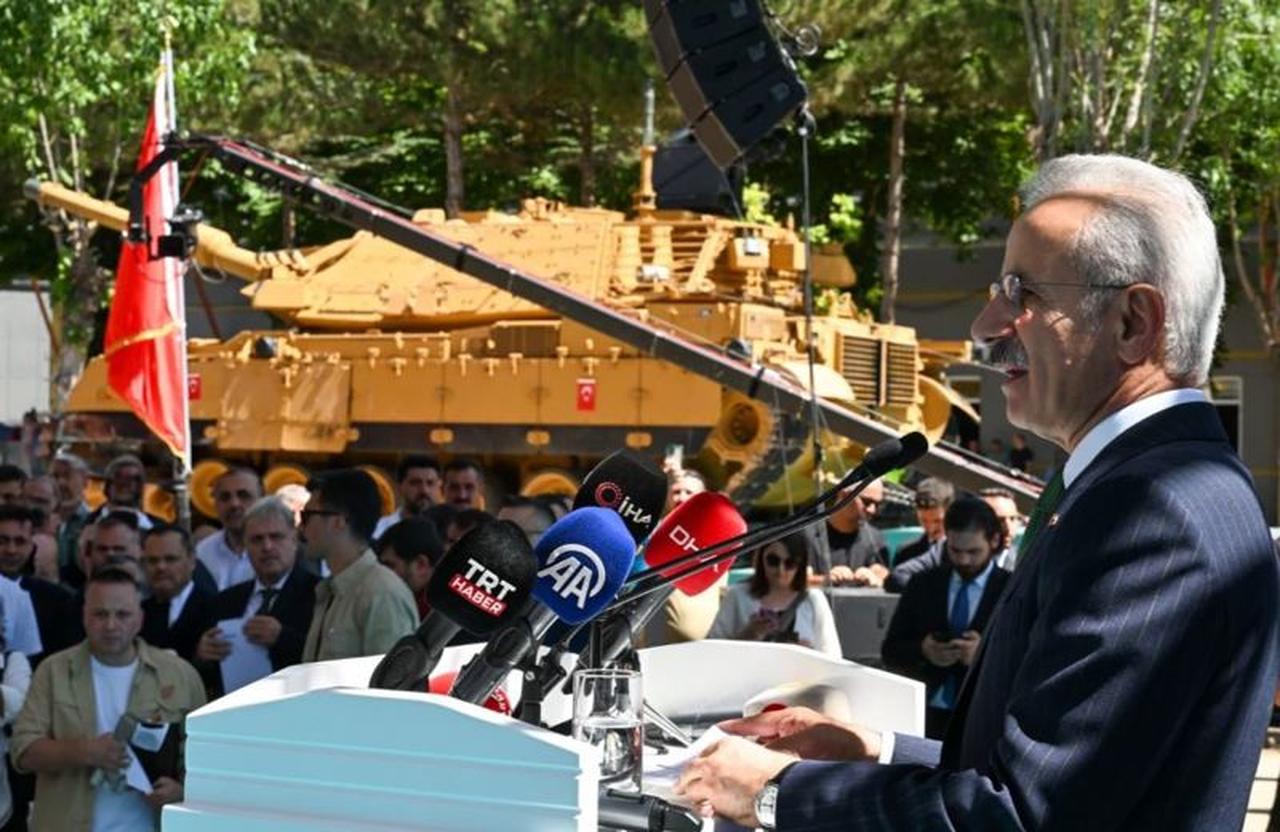Abdulkadir Uraloglu speaking at a ceremony with Türkiyes ZACENS-type tank wagons in the background produced by Türkiye Rail System Vehicles Industry Inc. (TURASAS) at its Sivas Regional Directorate, Türkiye on Dec. 28, 2025. (Photo via/TURASAS)