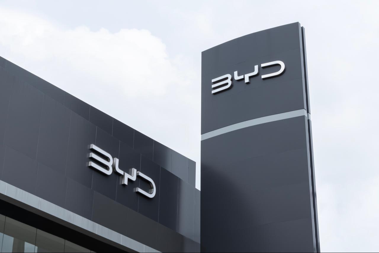The BYD logo displayed on a dealership building and billboard in Nonthaburi, Thailand, August 20, 2023. (Adobe Stock Photo)