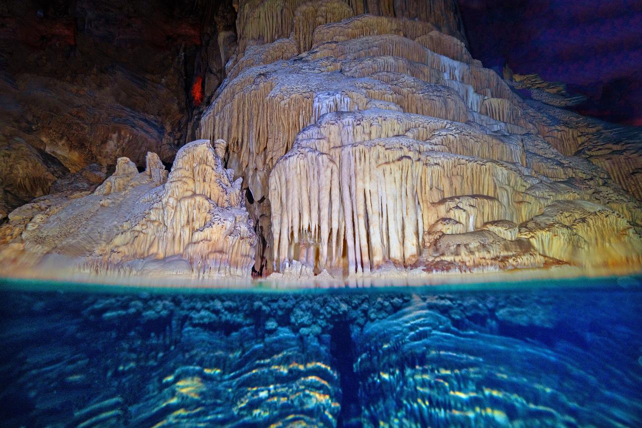 A view of stalactites, stalagmites, and travertines in the lake at Gilindire Cave, which was discovered for tourism when a shepherd was following a hedgehog in the Aydincik district of Mersin, Türkiye, Nov. 25, 2025. (AA Photo)