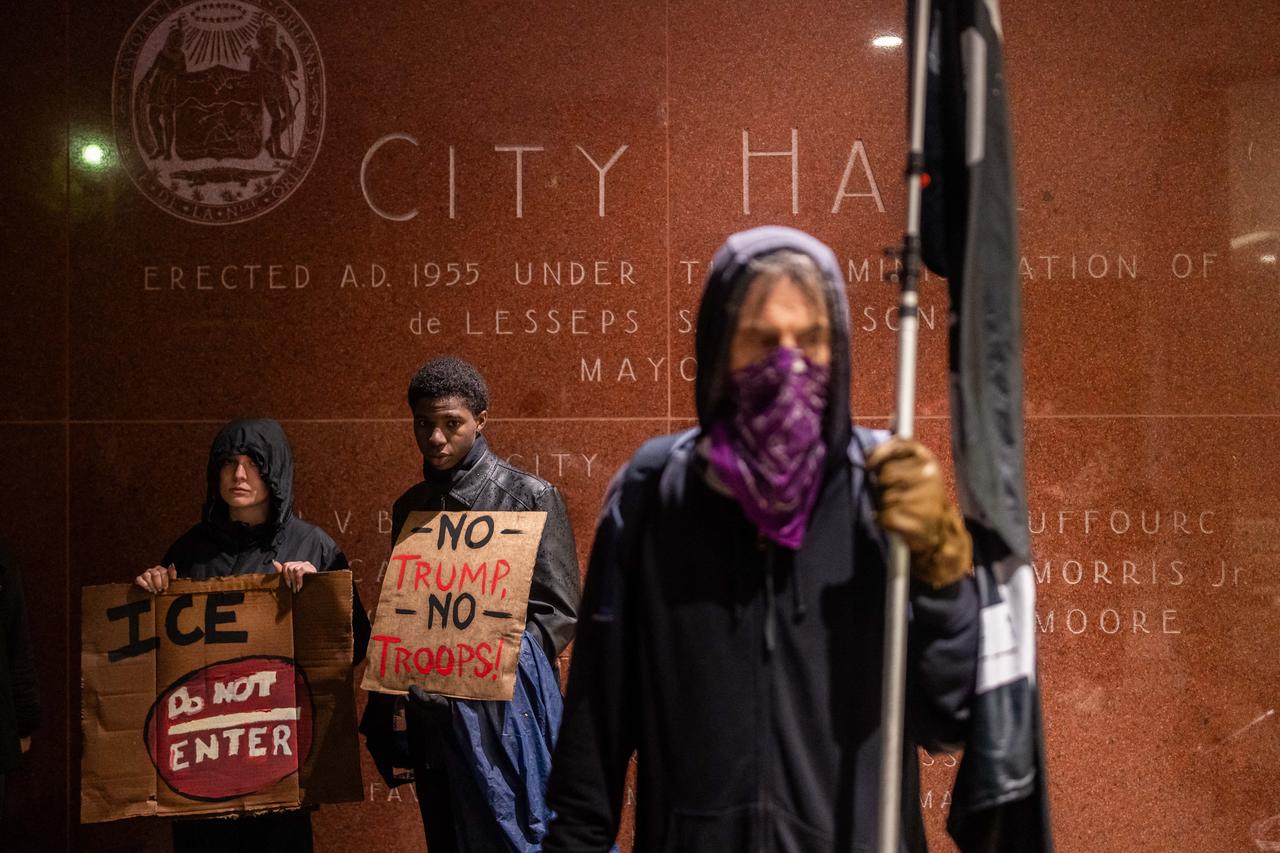 People protest against the ICE and Border Patrol operation outside of City Hall in New Orleans, Louisiana, on December 1, 2025. (AFP Photo)