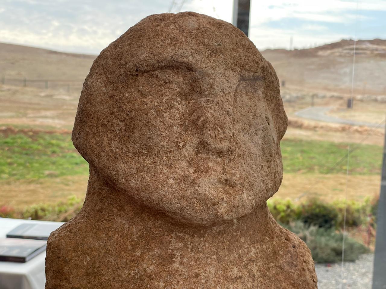 A human statue uncovered within the wall of Enclosure D at Gobeklitepe, believed to have been placed as a ritual offering during the Neolithic period. (Photo by Koray Erdogan/Türkiye Today)