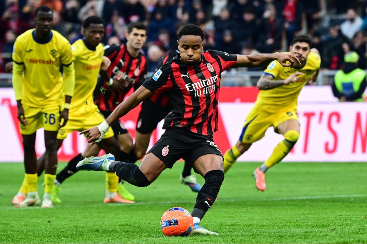 AC Milan's French forward #18 Christopher Nkunku shoots a penalty during the Italian Serie A football match between AC Milan and Hellas Verona at the San Siro stadium in Milan, northern Italy, December 28, 2025. (AFP Photo)