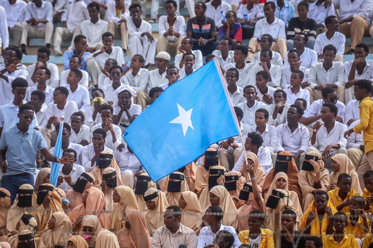 Residents wave Somali flags as they attend a rally denouncing Israel’s recent announcement recognizing the breakaway Somaliland region, in Mogadishu, Dec. 30, 2025. (AFP Photo)