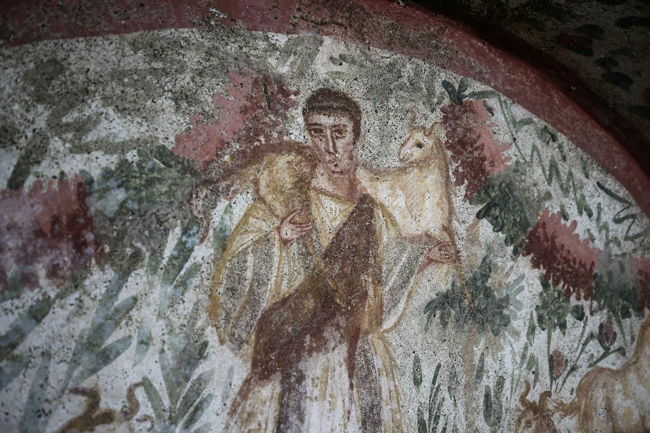 A view of the frescoed chamber tomb at Hisardere Necropolis in Iznik, Bursa, Türkiye, showing the Good Shepherd scene on the back wall and painted vegetation around it, Dec. 31, 2025. (AA Photo)
