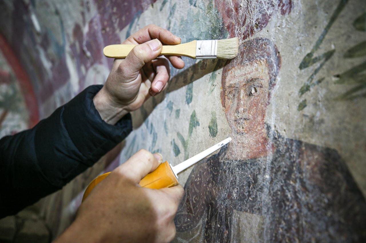 A view of the restoration work at  frescoed chamber tomb, Hisardere Necropolis in Iznik, Bursa, Türkiye, showing the Good Shepherd scene on the back wall and painted vegetation around it, Dec. 31, 2025. (AA Photo)