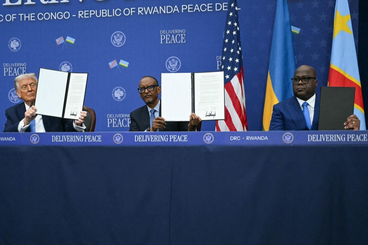 US President Donald Trump (L) participates in the signing ceremony of a peace deal with the President of Rwanda Paul Kagame (C) and the President of the Democratic Republic of the Congo Felix Tshisekedi (R) at the United States Institute of Peace in Washington, DC, December 4, 2025. (AFP Photo)