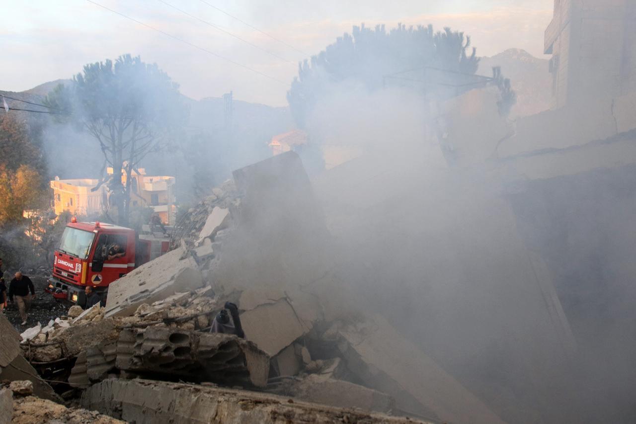 Firefighters and first responders gather at the site of an Israeli airstrike that targeted the southern Lebanese village of Jbaa, December 4, 2025. (AFP Photo)