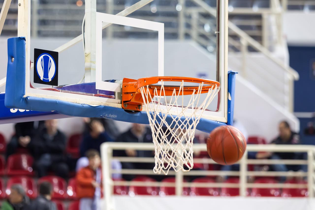 A basketball drops through the hoop during Eurocup game Paok vs Buducnost, Thessaloniki, Greece, Nov. 12, 2024. (Adobe Stock Photo)
