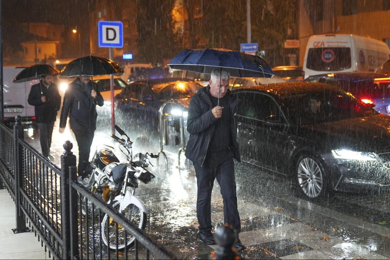 A man walking in the rain with an umbrella. Balikesir, Türkiye, October 28, 2025. (AA Photo)